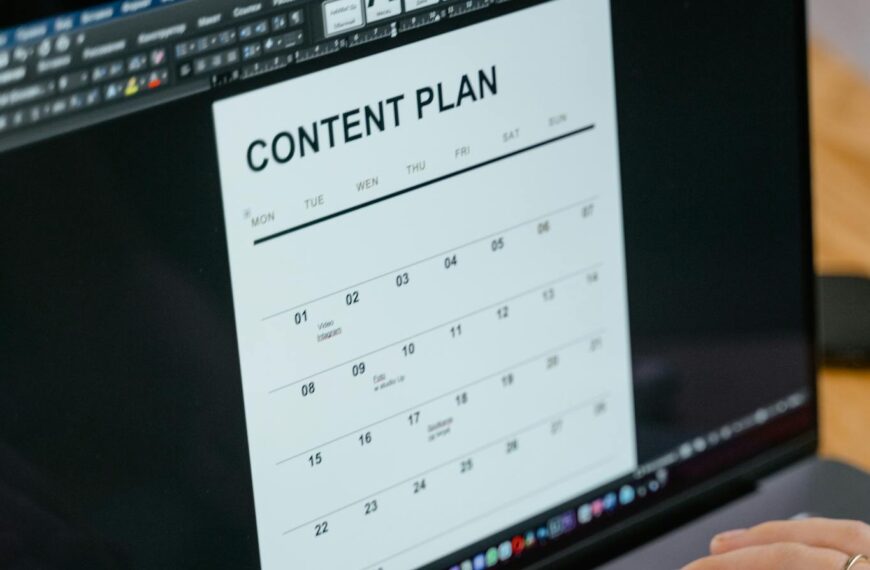 Close-up of hands typing on a laptop displaying a content plan document, ideal for business or marketing content.